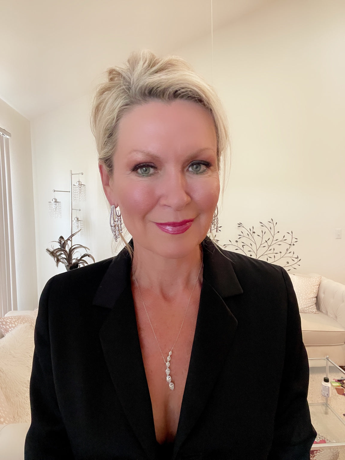 Christine wearing dancing teardrop hoop earrings