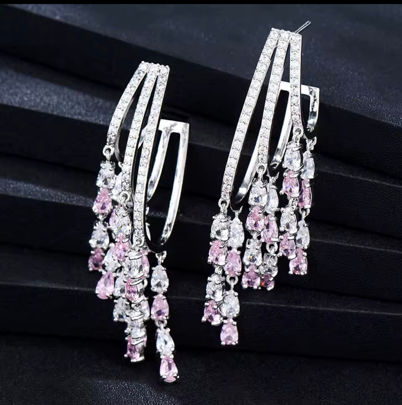 Pink and white simulated diamond dancing teardrop hoop earrings