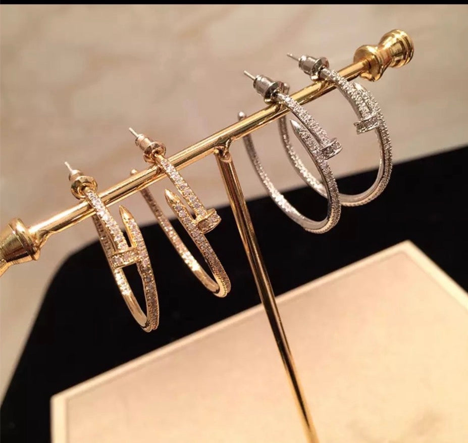 Gold and silver nail pavé hoop earrings