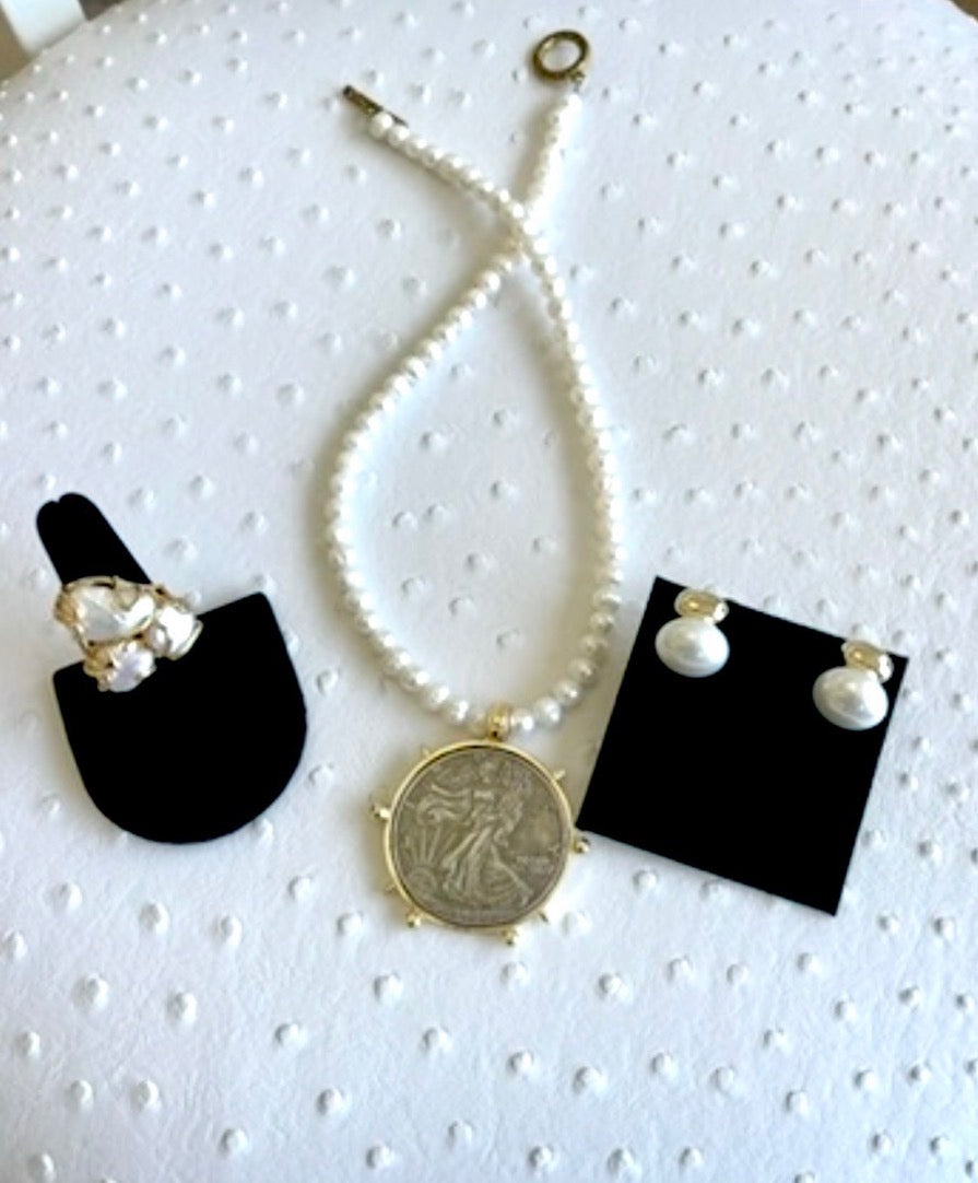 Pearl coin necklace styled with pearl jewelry; necklace sold separately