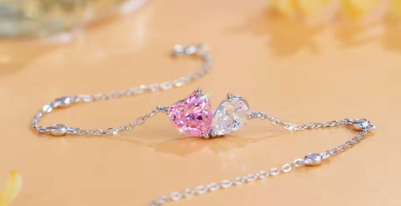 Matching pink heart and white pear simulated diamond jewelry in sterling silver