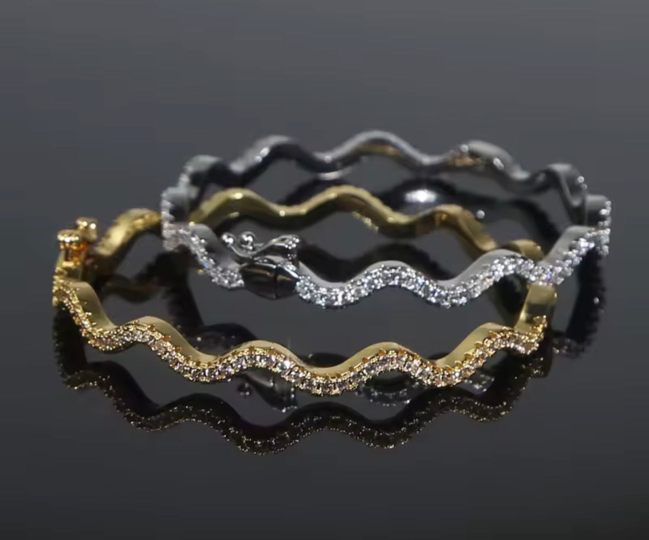Matching wavy pavé bangle bracelet in gold and silver finishes