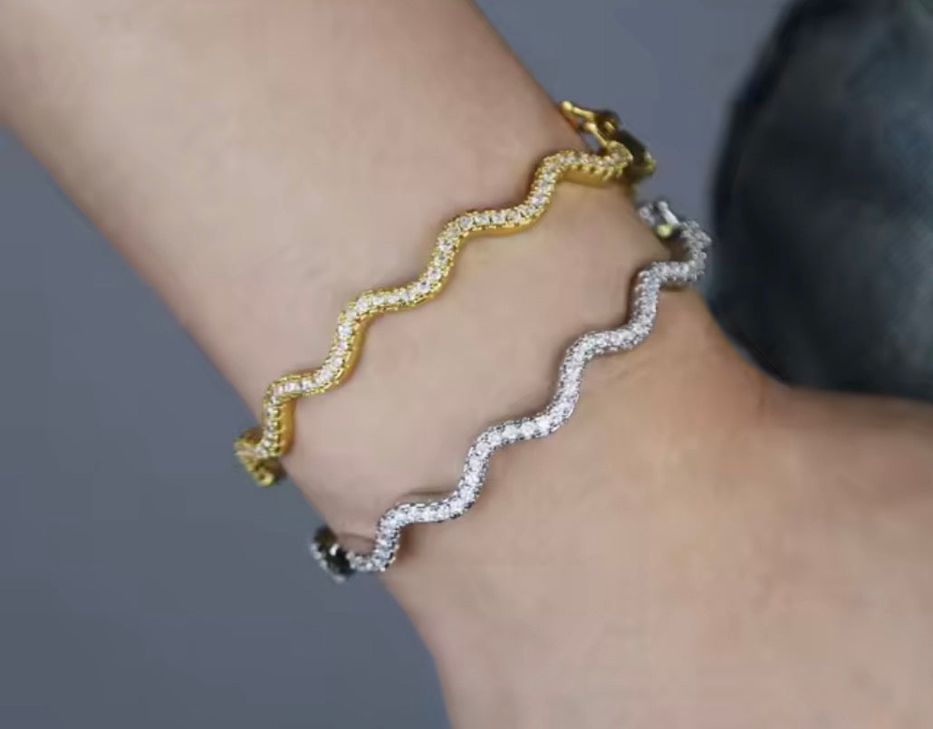 Matching wavy pavé bangle bracelet in gold and silver finishes