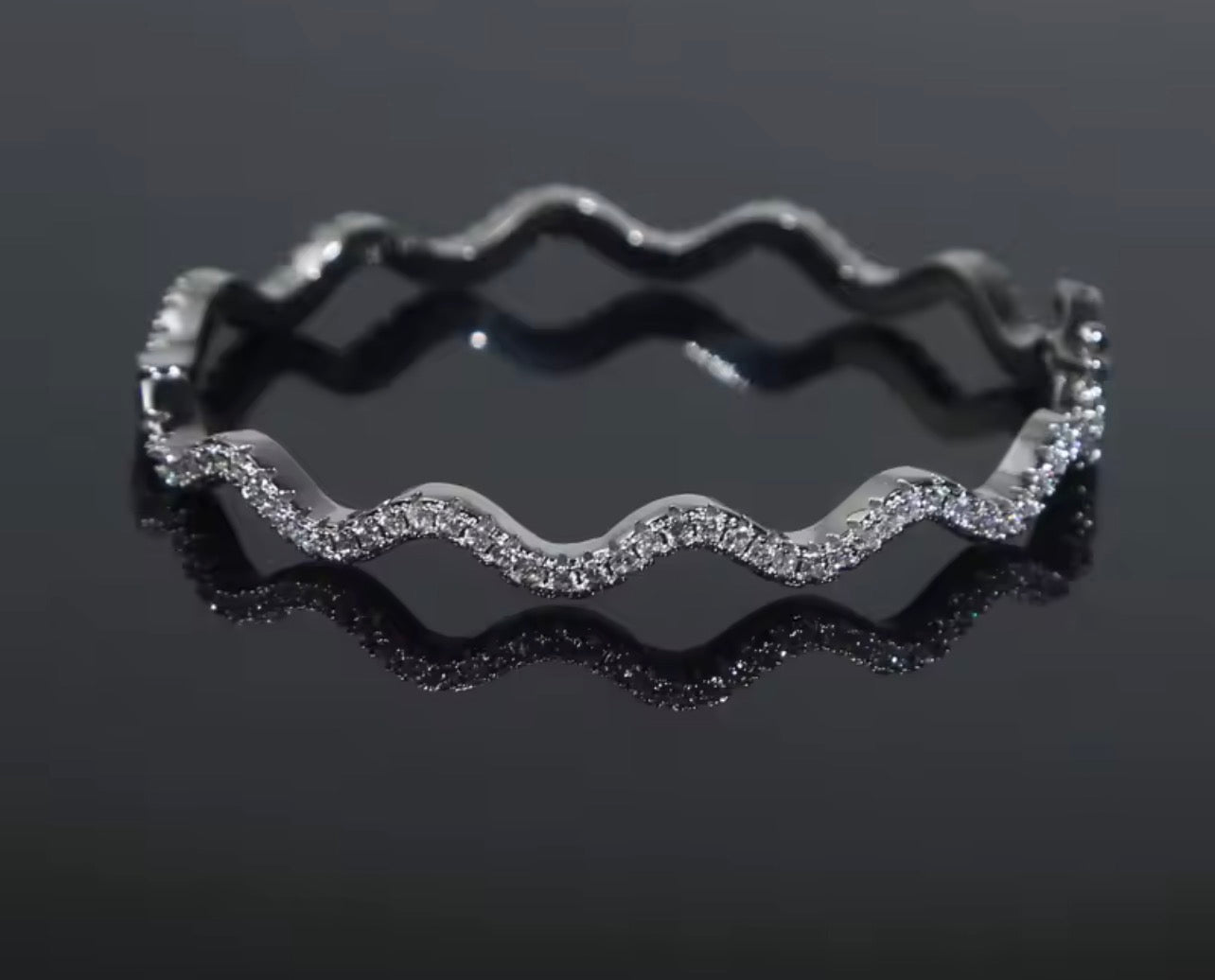 Matching wavy pavé bangle bracelet in gold and silver finishes