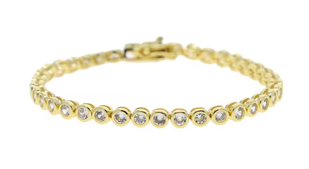Gold bezel set clear stone tennis bracelet