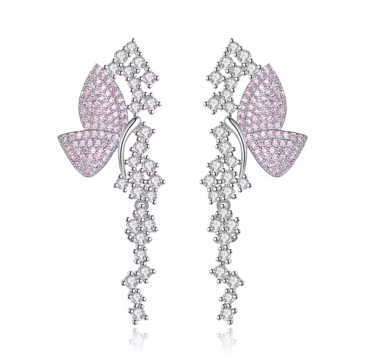 Pink pavé butterfly dangle earrings on a white background
