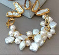 Multi freshwater pearl and gold-plated statement bracelet displayed on a jewelry stand