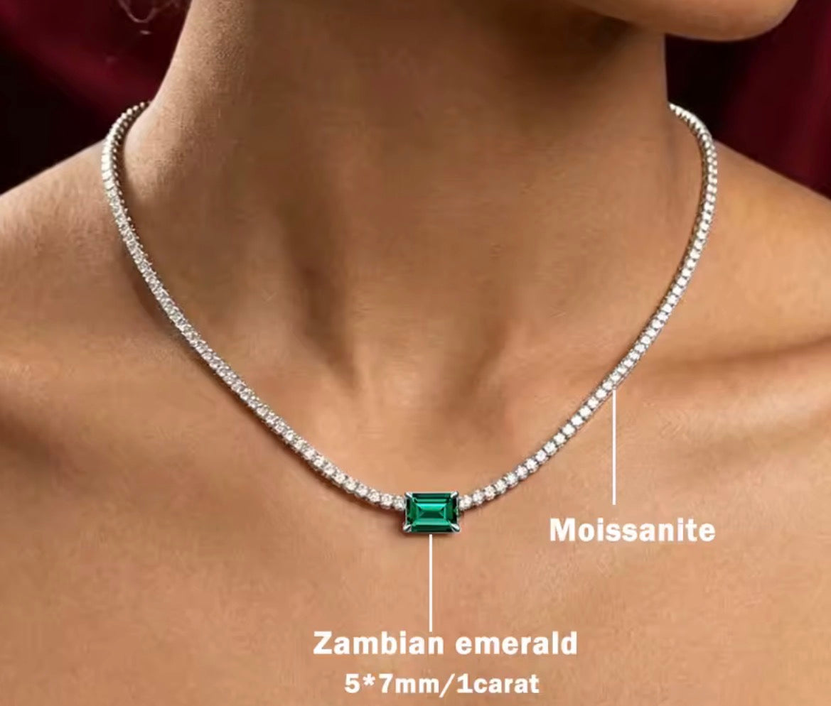 Emerald accent moissanite choker modeled