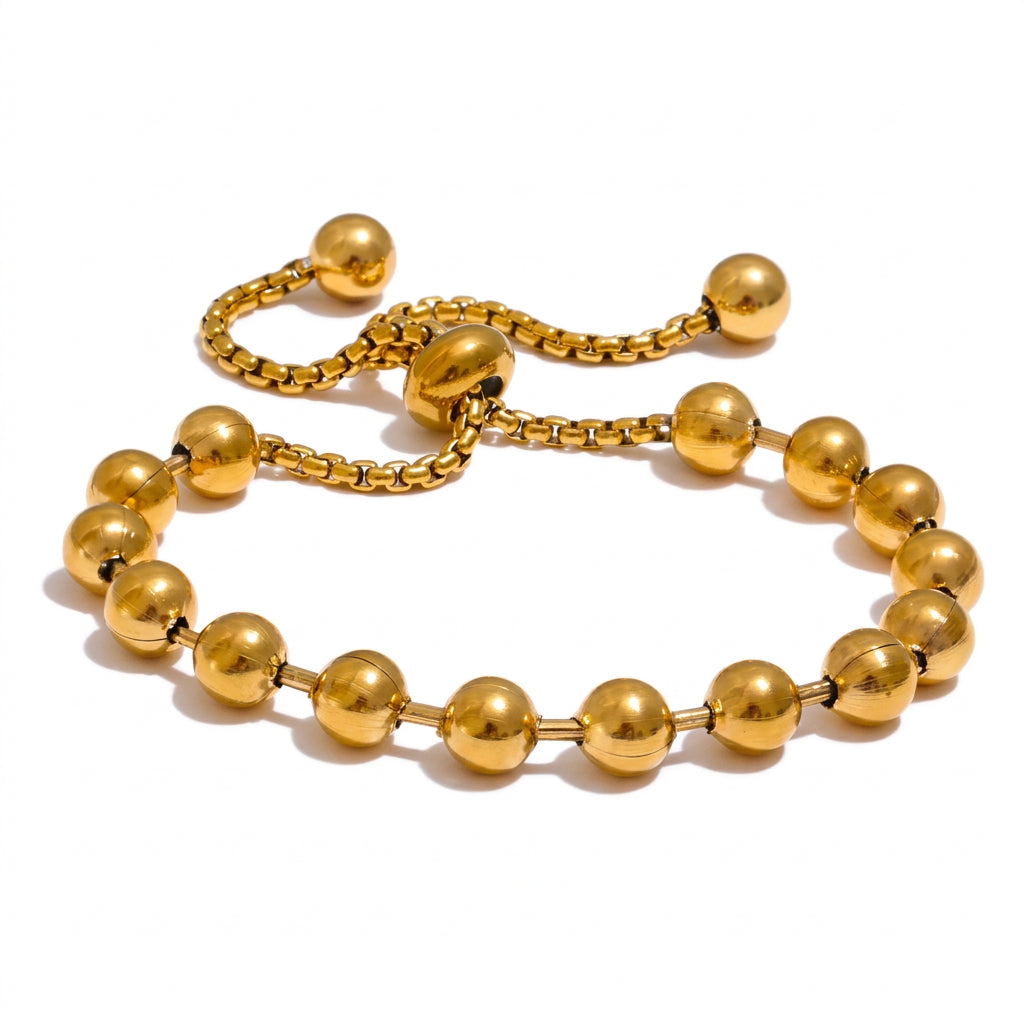 Gold ball adjustable bracelet with sliding cord closure