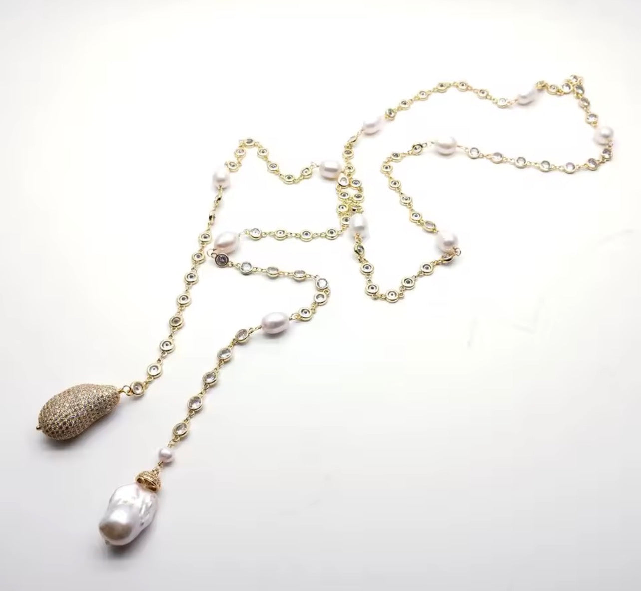 Gold and pearl wrap necklace with sparkling details