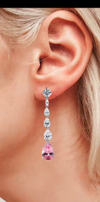 Long dangle lab moissanite earring shown worn