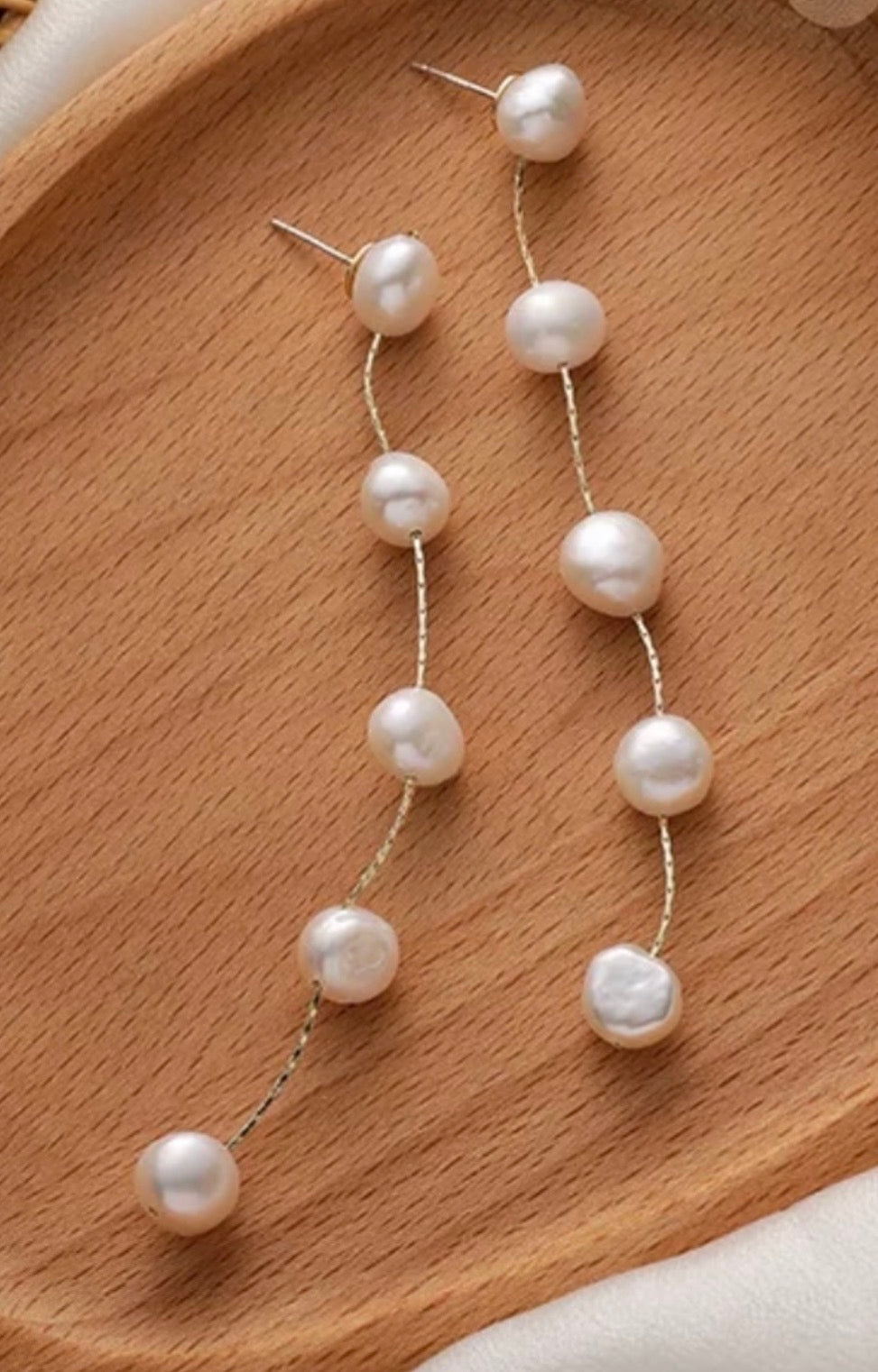 Long freshwater pearl dangle earrings with gold accent chain