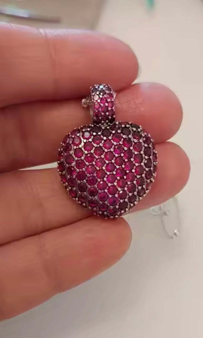 Close-up detail of the pavé simulated ruby puff heart pendant in sterling silver