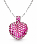Pavé simulated ruby puff heart pendant on a fine silver chain against a white background