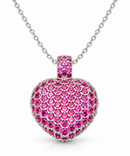 Pavé simulated ruby puff heart pendant on a fine silver chain against a white background