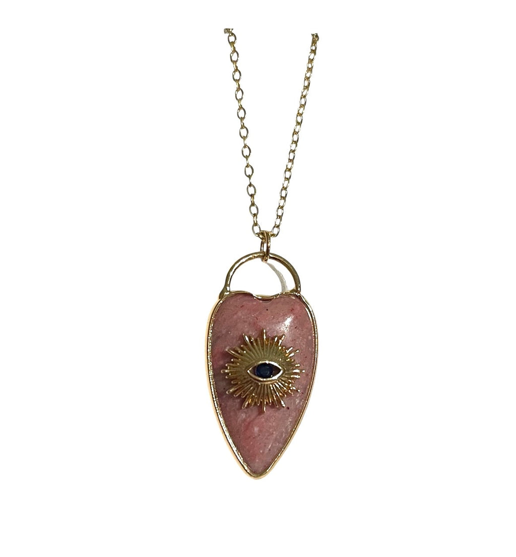 Pink quartz heart evil eye necklace on a white background