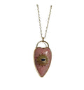Pink quartz heart evil eye necklace on a white background