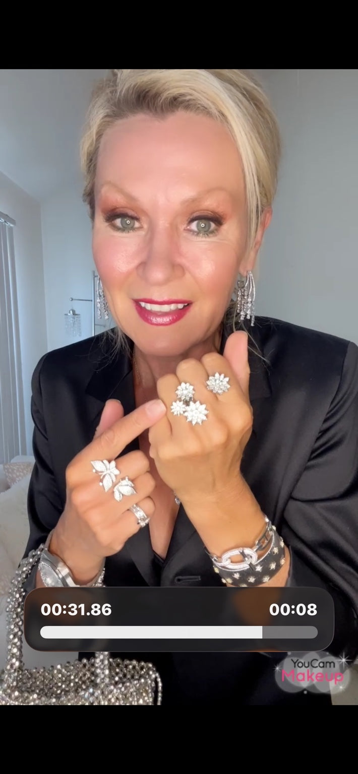 Christine modeling the butterfly and flower statement rings